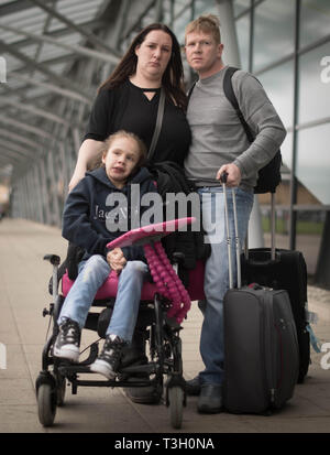 Emma Appleby (left), Lee Moore and their daughter Teagan who has severe epilepsy and was prescribed a cannabis-based medicine but has not been able to access it on the NHS, at London Southend Airport, Essex, after having the medicine they purchased in Amsterdam confiscated by customs officers. Stock Photo