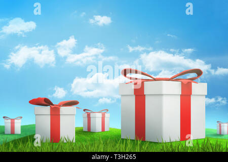 3d rendering of set of white gift boxes with red ribbons on green sunlit meadow under blue sky with white clouds. Stock Photo