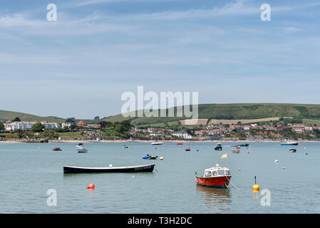 View of Swanage with the boats on the sea in the foreground Stock Photo