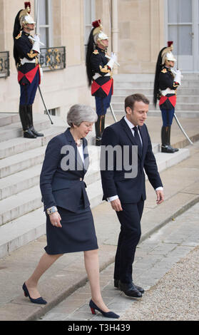 Prime Minister Theresa May with French President Emmanuel Macron leaves after Brexit talks at the ƒlysŽe Palace in Paris. Stock Photo