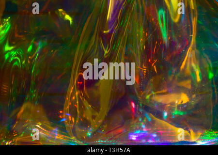 multicolored  holographic iridescent surface wrinkled foil  pastel Stock Photo