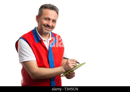 Friendly male hypermarket or supermarket employee taking notes on tablet with pan isolated on white studio background Stock Photo