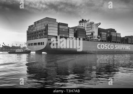 Close Up Moody Black And White Photo Of The COSCO SHIPPING CSCL SPRING Departing The Port of Los Angeles, California, USA. Stock Photo