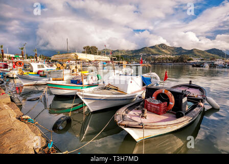 Colorful wooden fishing boats docked in Turgutreis harbour in Bodrum, Turkey Stock Photo