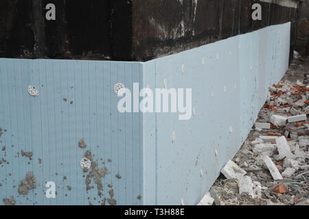 Basement rigid insulation details with damp proofing photo. House foundation insulation for energy saving. Stock Photo