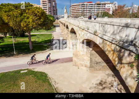 Valencia cyclists bridge Pont de Sant Josep Segle XVI Valencia Turia gardens Cycling Valencia Spain bicycle city Europe city park people cycle path Stock Photo