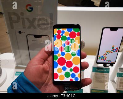 MONTREAL, CANADA - MARCH 28, 2019: Google Pixel 3 phone in a hand at mobile store. Google Pixel is a line of electronic devices developed by Google. Stock Photo