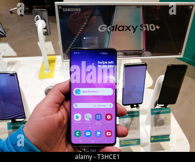 MONTREAL, CANADA - MARCH 28, 2019: Samsung Galaxy s10 in a hand at mobile store. Samsung Galaxy is a line of mobile devices made by Samsung. Stock Photo