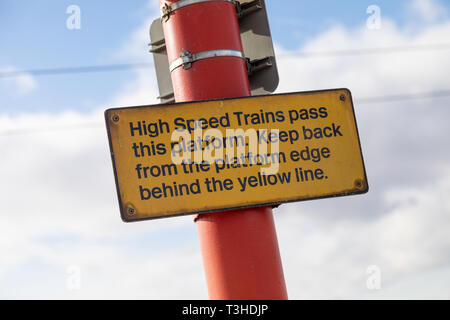 High speed trains pass this platform sign at Wigan North Western Railway Station Stock Photo