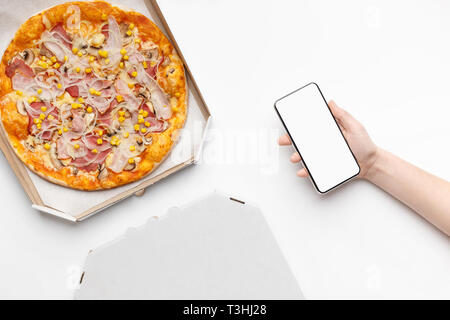 Order food online. Pizza in cardboard box, top view Stock Photo