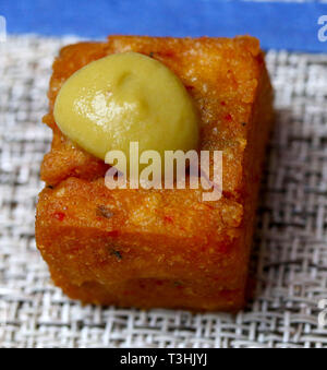 Chickpea appetizers with a mustard drop on crystal glass dish Stock Photo