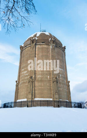 historic landmark water tower listed on national register of historic places atop snow covered  hill in tangletown neighborhood of minneapolis minneso Stock Photo
