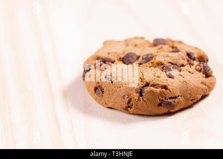 Oatmeal cookies with chocolate on a wooden background. Free space for lettering and design Stock Photo