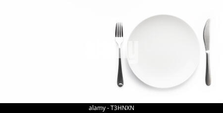 Empty plate with fork and knife Stock Photo