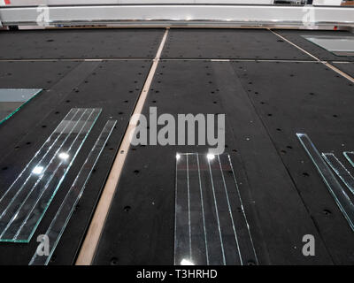 industrual laser cutting CNC automatic machine system with long pieces of glass Stock Photo