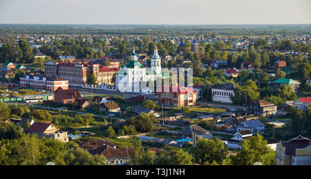 View on the modern residential quarters with the foothills Church of St. Michael the Archangel in the piedmont near Tobolsk kremlin. Tobolsk. Russia Stock Photo