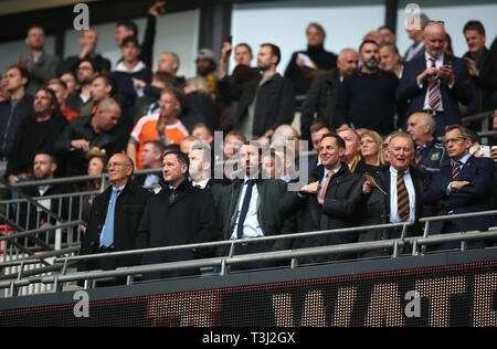 England manager Gareth Southgate (centre), assistant Steve Holland (second left) and departing FA Chief Executive Officer Martin Glenn (far right) in the stands during the FA Cup semi final match at Wembley Stadium, London. Stock Photo