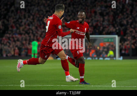 Liverpool's Naby Keita (right) celebrates scoring his side's first goal of the game with Liverpool's Roberto Firmino during the UEFA Champions League quarter final, first leg match at Anfield, Liverpool. Stock Photo