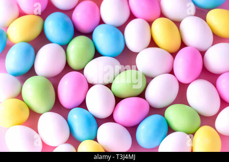 Background Small colorful candy eggs in the stand. Easter celebrate concept. Close up. Stock Photo
