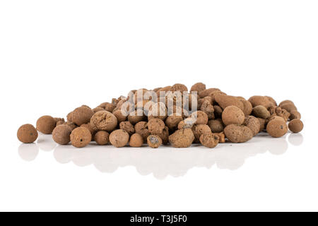 Lot of whole brown clay pebbles (leca) stack isolated on white background Stock Photo