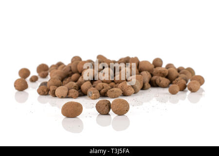 Lot of whole brown clay pebbles (leca) isolated on white background Stock Photo