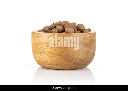 Lot of whole brown clay pebbles (leca) with wooden bowl isolated on white background Stock Photo