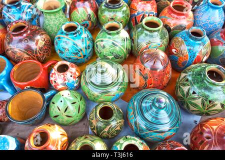 Assorted Traditional Costa Rica Porcelain Pottery and Crafts sold as Colorful Tourist Souvenirs in Manuel Antonio outdoor bazaar market Stock Photo