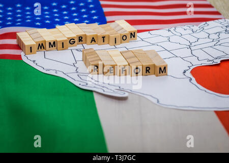 Immigration Reform concept on US-Mexico border map with United States and Mexico flags Stock Photo