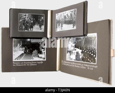 Rudolf Heß, four photo albums Trier, Stuttgart, Württemberg, Schwindegg Memory album of Heß' trip to Trier and Saarburg on 19th March 1936, 25 well-preserved large-size photos, memory album of his trip to Stuttgart during the campaign 1936, 38 photos of various sizes documenting his reception at the airport, his passing the guard of honour, car ride through the City of Stuttgart, rally in the town hall. Photo album commemorating his meeting with political leaders of the Gau Württemberg/Hohenzollern in the Fürth tent camp on the occasion of the Reich Party Congress 1934, 50 , Editorial-Use-Only Stock Photo