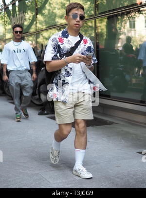 MILAN, ITALY -JUNE 18, 2018: Fashionable man posing for photographers in  the street before GIORGIO ARMANI fashion show, during Milan Fashion Week  Men Stock Photo - Alamy