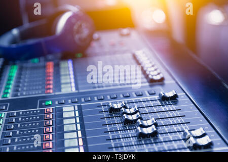 Music mixer sound recording engineer control desk for dj at stage show. Stock Photo