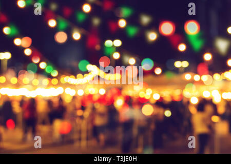 blur bokeh night festival warm light cool chill party in walking street. Stock Photo