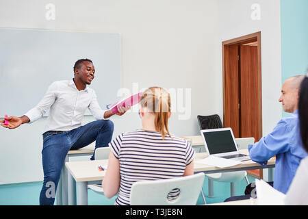 African student giving a presentation in a university course or seminar for further education Stock Photo