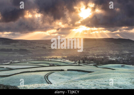 Teesdale, County Durham UK. Wednesday 10th April. UK Weather. It was a cold and frosty start to the day in Teesdale and as the sun began to rise spectacular crepuscular rays began to rake across the landscape. Credit: David Forster/Alamy Live News Stock Photo