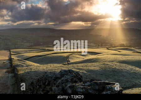 Teesdale, County Durham UK. Wednesday 10th April. UK Weather. It was a cold and frosty start to the day in Teesdale and as the sun began to rise spectacular crepuscular rays began to rake across the landscape. Credit: David Forster/Alamy Live News Stock Photo