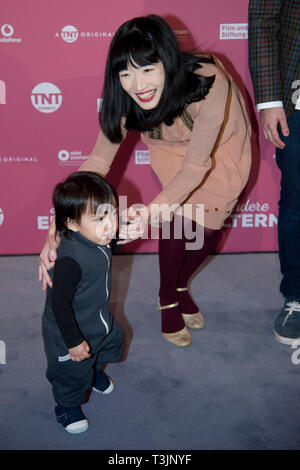 Moeko SUNAYA, actress, with toddler, name unidentified, portrait, portrait, photograph, single image, red carpet, red carpet show, arrival, arrival, 'Other Parents' premiere on 14th March 2019 at Residenz-Kino in Koeln , | usage worldwide Stock Photo