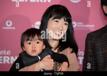 Moeko SUNAYA, actress, with toddler, name unidentified, portrait, portrait, photograph, single image, red carpet, red carpet show, arrival, arrival, 'Other Parents' premiere on 14th March 2019 at Residenz-Kino in Koeln , | usage worldwide Stock Photo