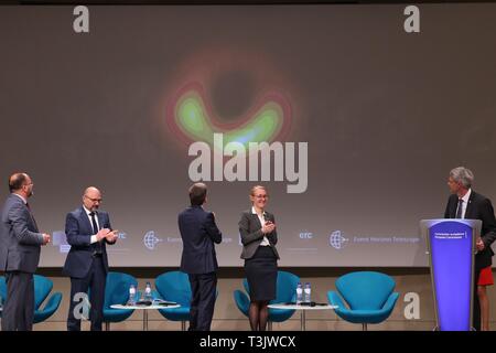 Brussels, Belgium. 10th Apr, 2019. Photo taken on April 10, 2019 shows a press conference unveiling the first image of a black hole in Brussels, capital of Belgium. Astronomers said here Wednesday that they captured the first image of a black hole, unveiling the first direct visual evidence of an unseeable cosmic object and its shadow. Credit: Zhang Cheng/Xinhua/Alamy Live News Stock Photo