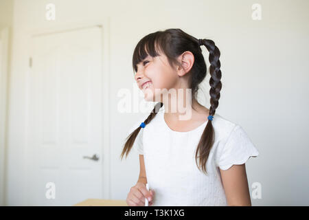 Happy little girl. She is 6-7 years old. Stock Photo