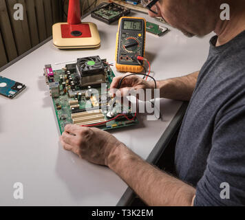 Multimeter testing a circuit board Stock Photo - Alamy