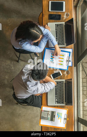 Asian office employee in shirt discuss about work Stock Photo