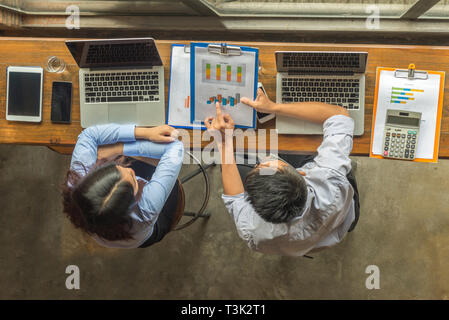 Top view of employees discuss about financial report Stock Photo