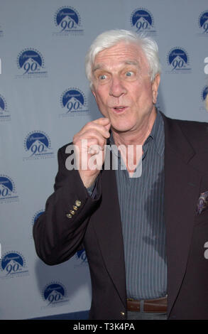 LOS ANGELES, CA. July 14, 2002: Actor LESLIE NIELSEN & date at the Paramount Pictures 90th Anniversary Gala at Paramount Studios, Hollywood. © Paul Smith / Featureflash Stock Photo