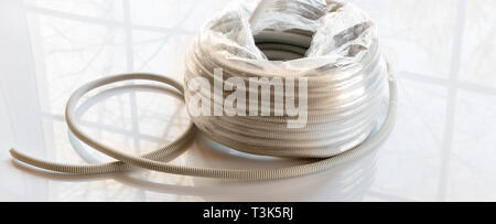 Corrugated gray plastic pipes used for electrical lines Stock Photo