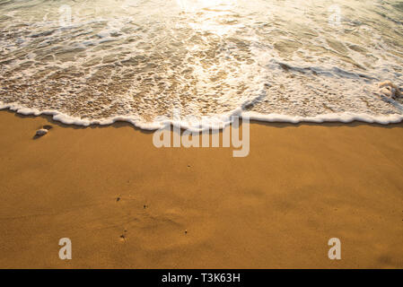Soft wave of blue ocean on sandy beach. Background. Stock Photo
