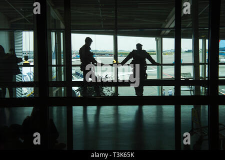 The heavy armed policemen patrol the Schiphol Airport, Amsterdam, Netherlands, on Thursday, April 4, 2019.  (CTK Photo/Libor Sojka) Stock Photo