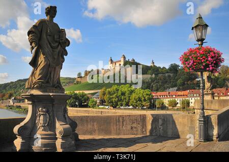 View from the old Main bridge to the fortress Marienberg, on the left the statue of the martyr Sankt Totnan, Lower Franconia, Bavaria, Germany, Europe Stock Photo