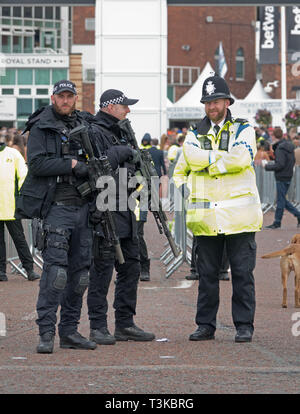 Heavily armed UK police officers on duty at the 2019 Aintree Grand National Meeting Stock Photo