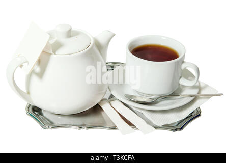 Breakfast metal tray filled with teapot, spoon and tea cup.  Isolated on white background Stock Photo
