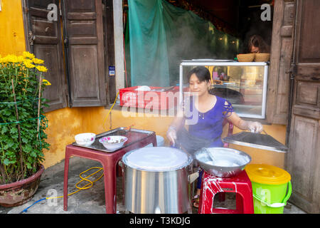 Vietnamese woman making rice paper cakes on a back street in the old quarter of Hoi An, Quang Nam Provence, Vietnam, Asia Stock Photo